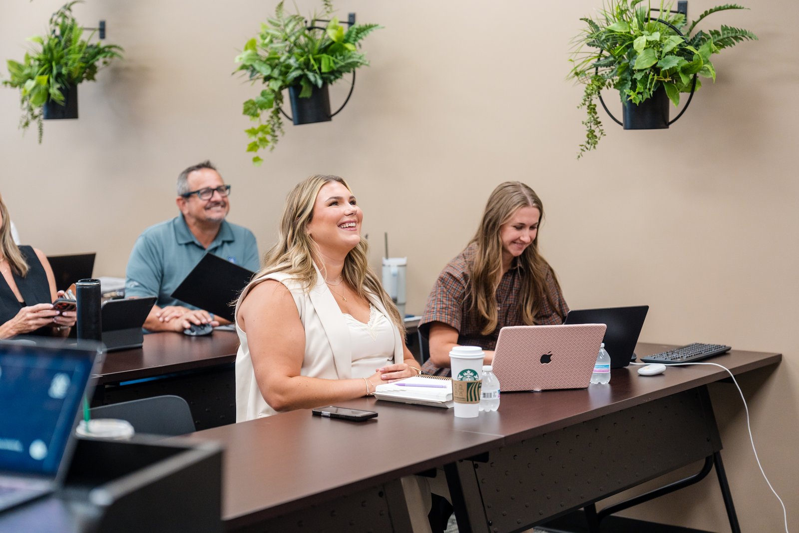 Attendees engaged in a corporate training session